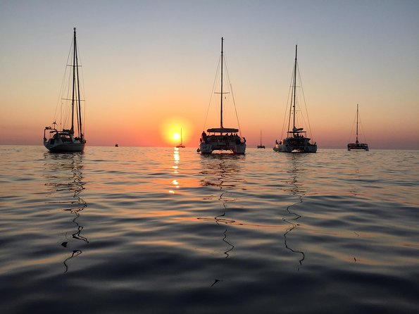 Santorini Luxury Catamaran Sunset Cruise with BBQ, Drink and Transfer - Swimming at Santorini’s Hot Springs