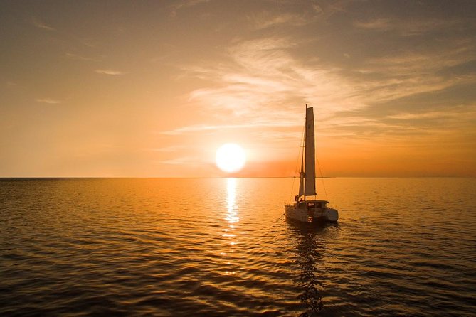 Santorini Luxury Catamaran Sunset Cruise with BBQ, Drink and Transfer - White Beach, barbecue, and time to relax