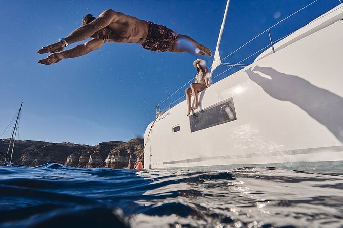 Santorini Oia: Luxury Sunset Cruise with Fresh Fish BBQ & Drinks - Nea Kameni and the sulfur springs