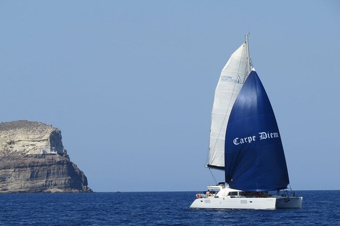 Santorini Oia: Luxury Sunset Cruise with Fresh Fish BBQ & Drinks - Thirassia: a calm first swim