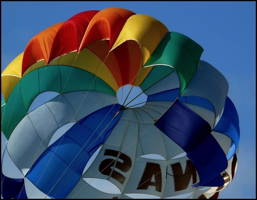 Santorini: Parasailing Flight Experience at Black Beach - What parasailing above Black Beach is really like