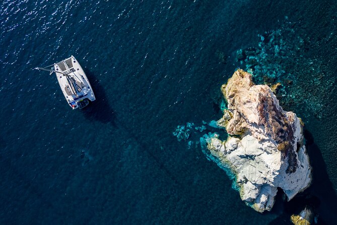 Santorini Platinum Catamaran Cruise with Meal, BBQ and Open Bar - Red Beach opens the coastal show