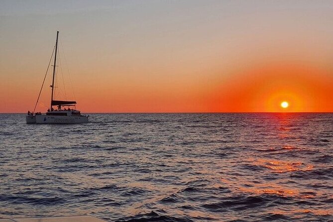 Santorini Private Catamaran Cruise with BBQ, Open Bar & Transfers - Indian Rocks, the lighthouse, and cliffside villages
