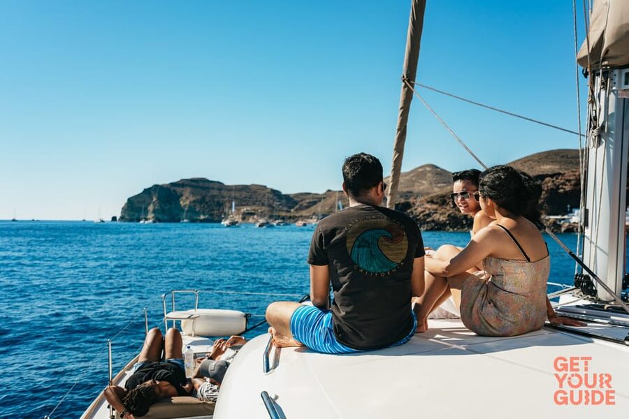 Santorini: Private Catamaran Tour with BBQ Meal and Drinks - A final swim and a look toward Thirasia