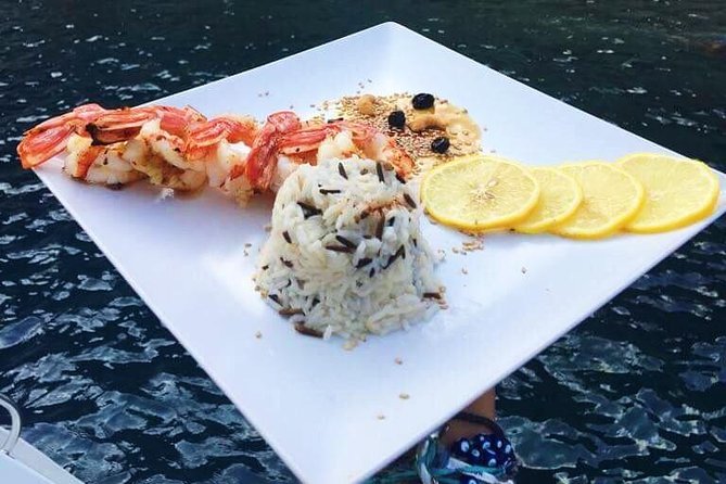 Santorini Small-Group Catamaran Sailing Trip(BBQ,drinks, transfer) - White Beach: The Main Meal and Longest Stop