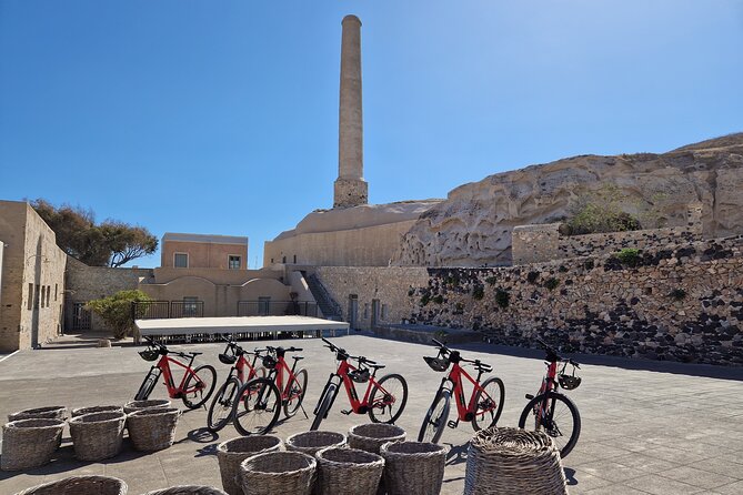 Santorini Small Group Guided E-bike Tour & Local Tomato Museum - Starting at the Tomato Industrial Museum in Vlychada