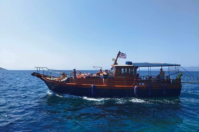 SemiPrivate Trip on 50ft Traditional Wooden Boat with Greek Lunch - Arkos gives you an early swim