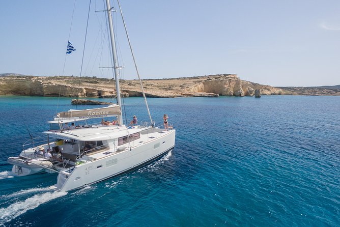 Shared Catamaran All inclusive-Day Cruise to Naxos or Paros - Swimming in clear water around Naxos and Paros
