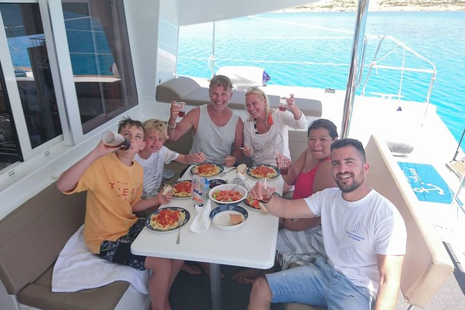 Shared Catamaran All inclusive-Day Cruise to Naxos or Paros - Lunch cooked below deck, with wine and beer on hand