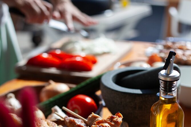 Souvlaki Cooking Class with Locals – Transfer Included - Chopping vegetables and wrapping the pita