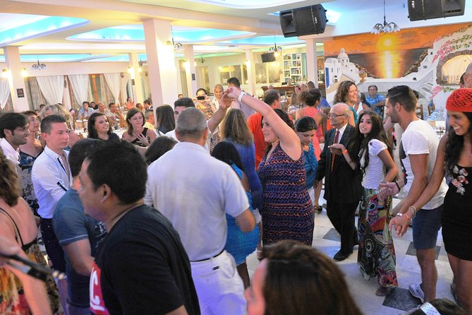 Traditional Greek Night live Music & Dinner Show in Santorini - Unlimited drinks and the social side of dinner
