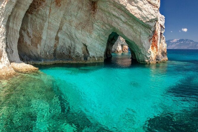 Zakynthos Blue Caves and Navagio bay - Agios Andreas adds cliffs, an arch, and old ruins